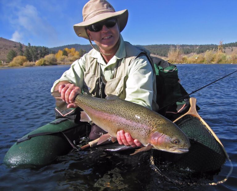 The author with an "average size" trout from Alpers' Pond in 2006.  Photo by Bill Beecher.
