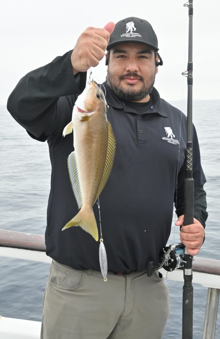 VOLUNTEER GIOVANNI PEREZ spent his day helping, hooking, and handing, but managed to land a nice whitefish and a limit of sculpin.