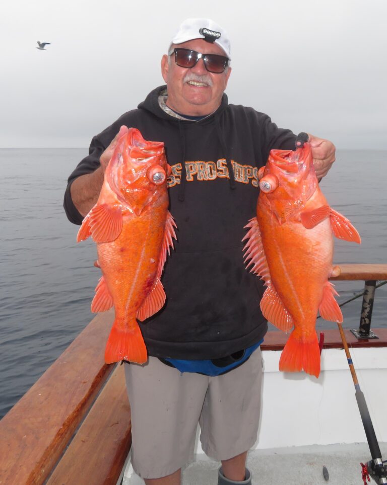 WON CHARTER REGULAR David Castro with a pair of reds he boated on a double while fishing squid at 200-feet plus alongside San Nicolas Island.