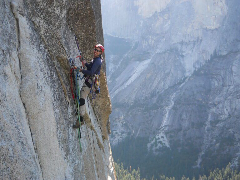 Matt Johanson retrieves gear from a section of the climb.