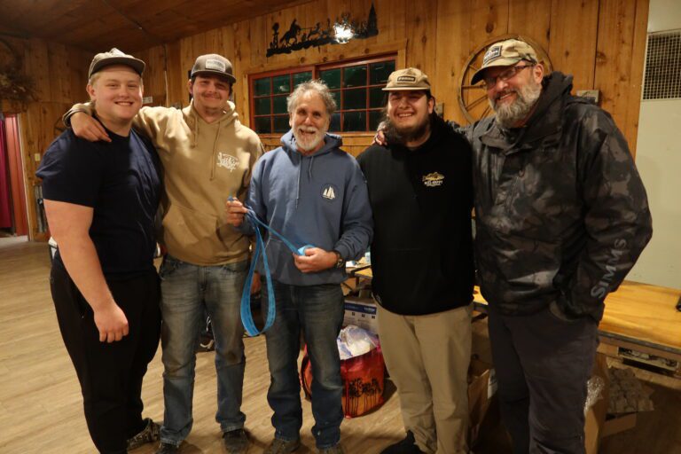 TEAM TROUSER TROUTERS took top tier tournament prize with First Place honors in Fly Fishing Team division. Tournament Director, Michael Schweit, center, hands out coveted Glass Mugs.