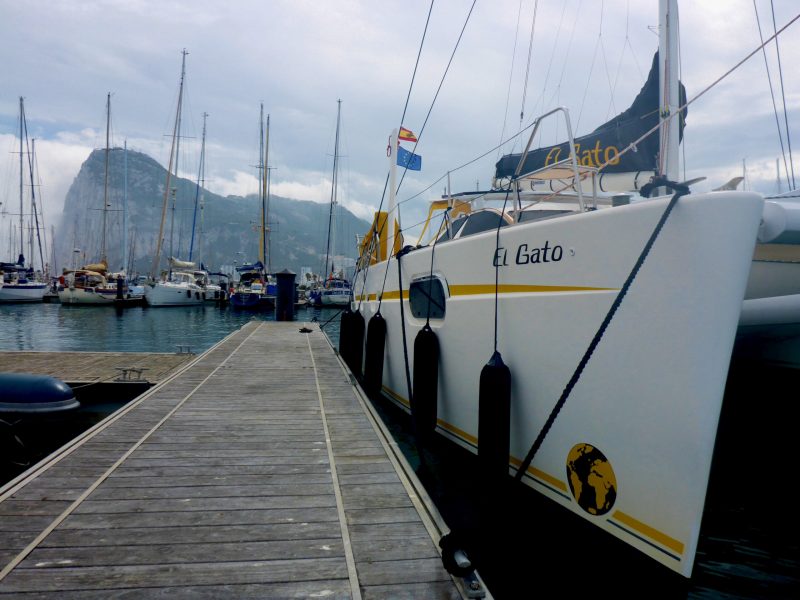 S/V El Gato docked beneath the Rock of Gibraltar: Betsy (Crowfoot) Senescu