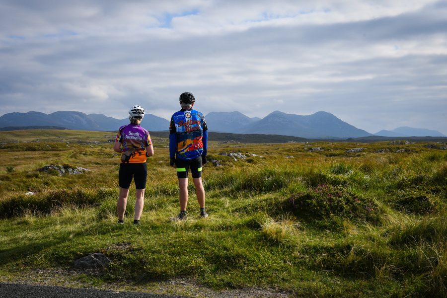 Cyclists stop along the Bog Road between Clifden and Carna to view the Twelve Bens.